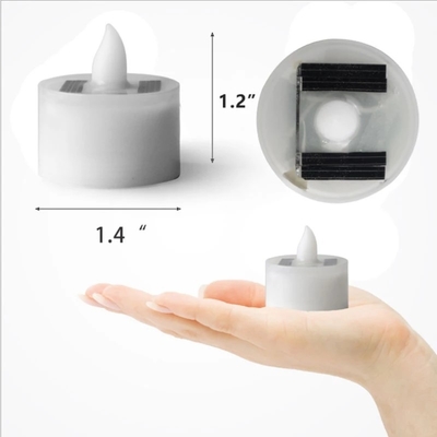 La candela alimentata solare senza fiamma del LED accende le luci decorative dell'atmosfera dell'interno