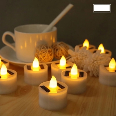 La candela alimentata solare senza fiamma del LED accende le luci decorative dell'atmosfera dell'interno